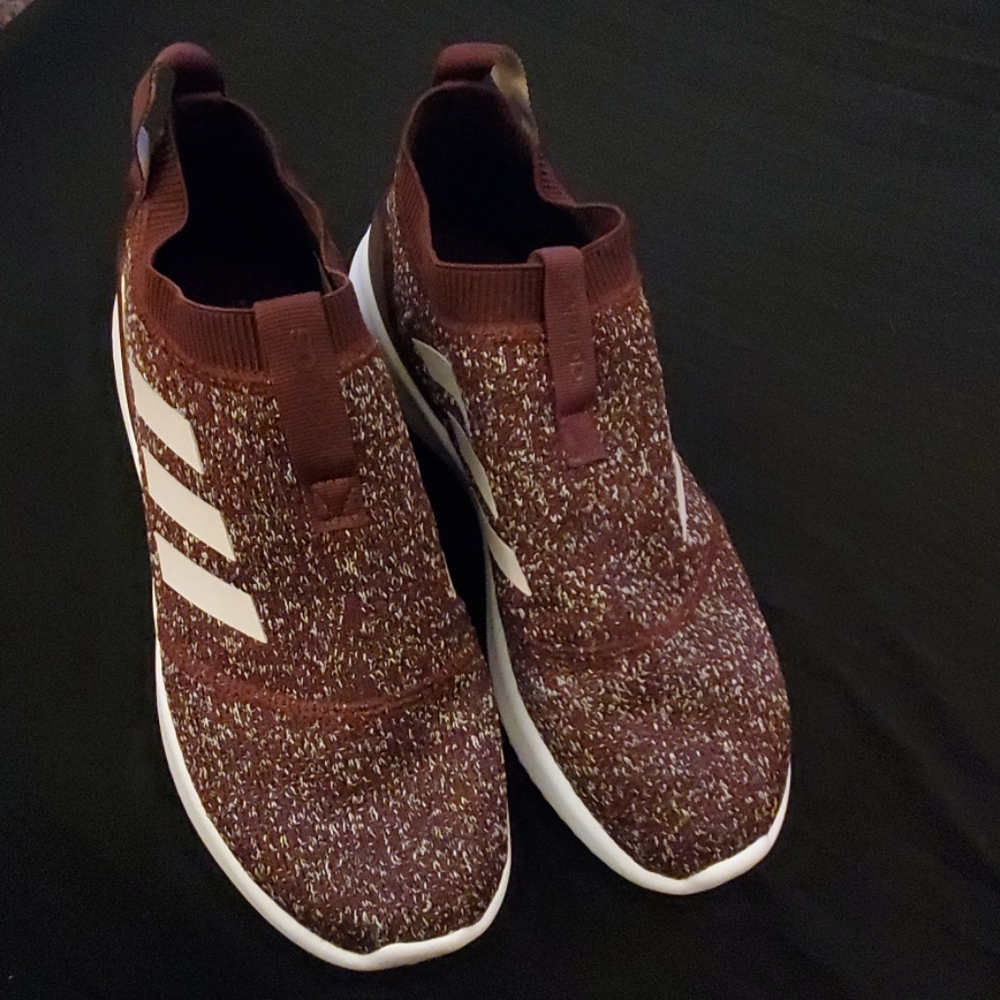 Burgundy and white adidas sneakers